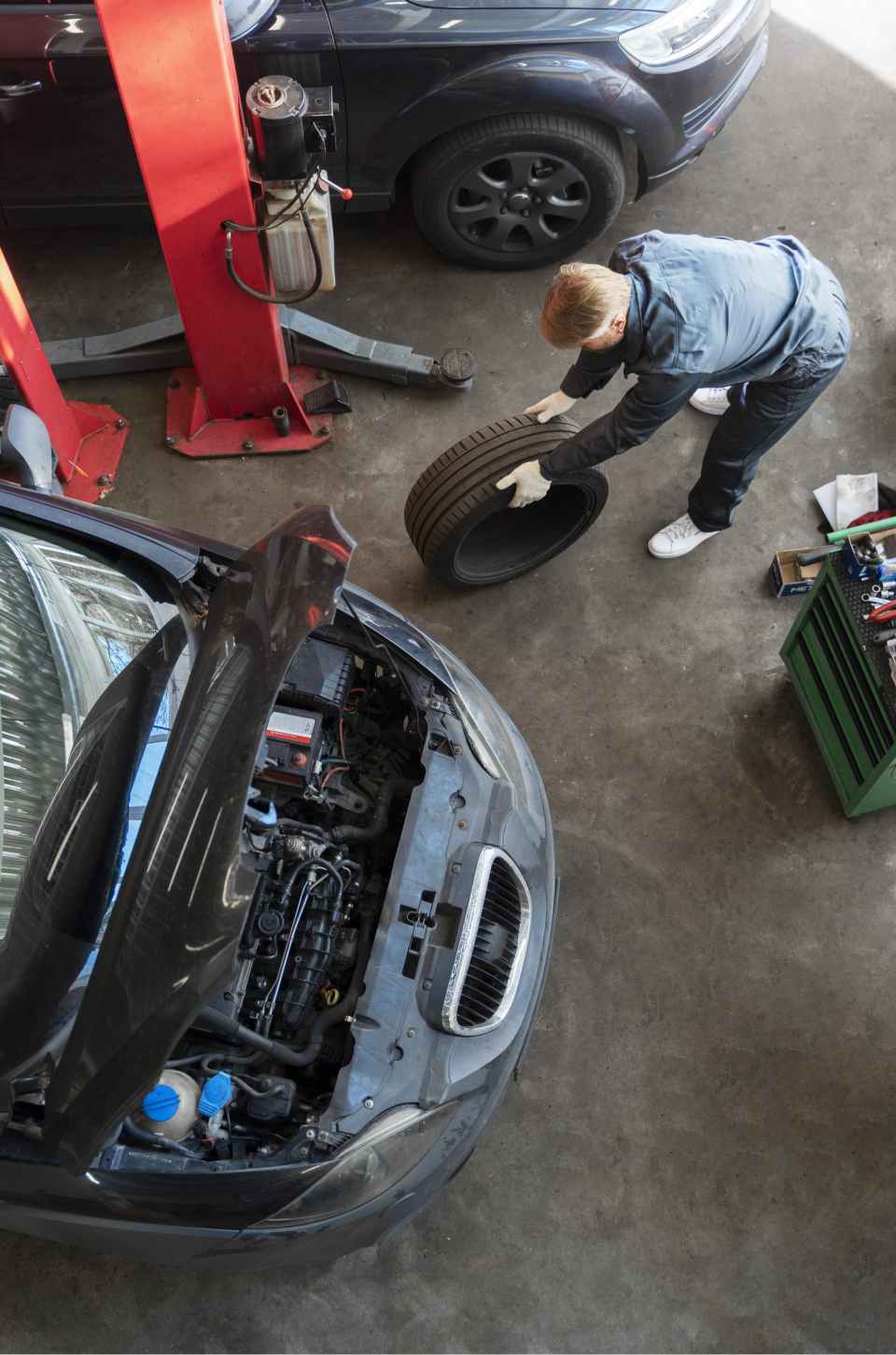 a man is working on a car's engine